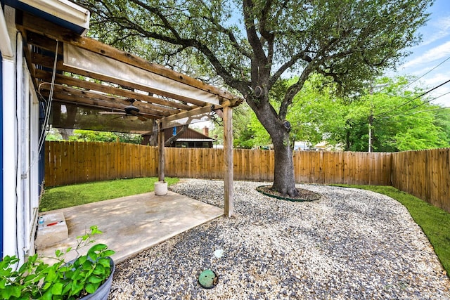 14201 Modesta Pl, San Antonio, TX 78247 - fenced backyard with a ceiling fan, a patio, and a pergola