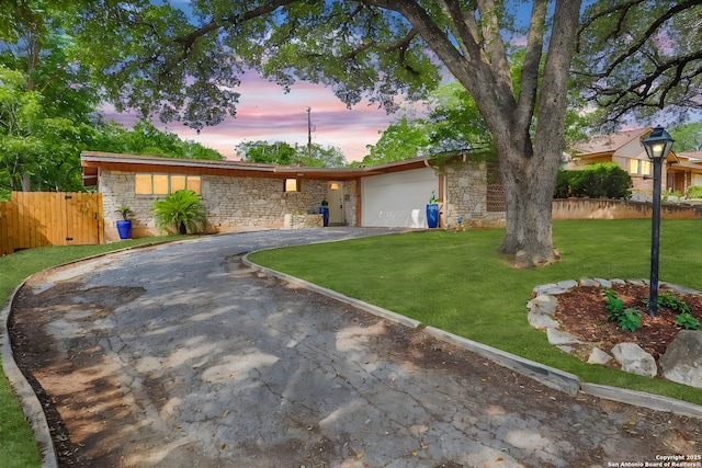 230 Tammy Dr, San Antonio, TX 78216 - view of front of house with driveway, stone siding, and an attached garage