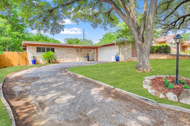 230 Tammy Dr, San Antonio, TX 78216 - single story home with stone siding, driveway, and a garage