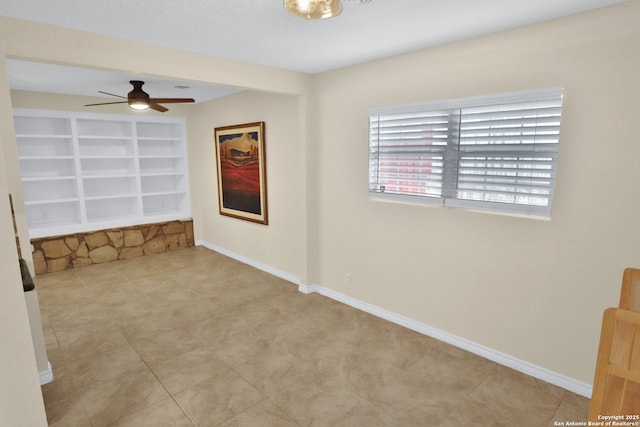 230 Tammy Dr, San Antonio, TX 78216 - unfurnished room featuring ceiling fan, built in shelves, baseboards, and tile patterned flooring