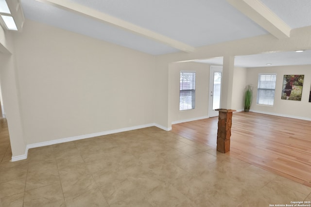230 Tammy Dr, San Antonio, TX 78216 - unfurnished living room with beam ceiling, baseboards, and light tile patterned floors