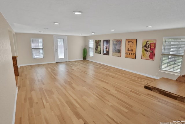 230 Tammy Dr, San Antonio, TX 78216 - unfurnished living room featuring light wood-style floors, baseboards, and recessed lighting