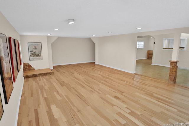 230 Tammy Dr, San Antonio, TX 78216 - unfurnished living room featuring light wood-style flooring, arched walkways, recessed lighting, and baseboards