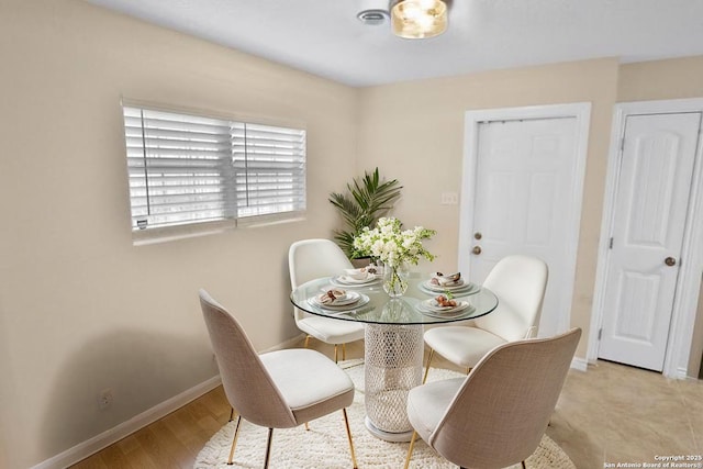 230 Tammy Dr, San Antonio, TX 78216 - dining area featuring baseboards and light wood-style flooring