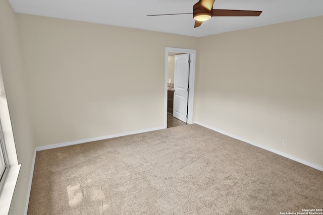230 Tammy Dr, San Antonio, TX 78216 - empty room with dark carpet, ceiling fan, and baseboards
