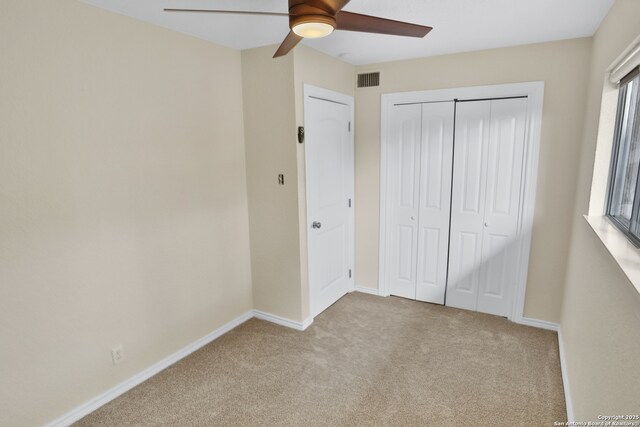 230 Tammy Dr, San Antonio, TX 78216 - unfurnished bedroom featuring carpet floors, a closet, baseboards, and a ceiling fan