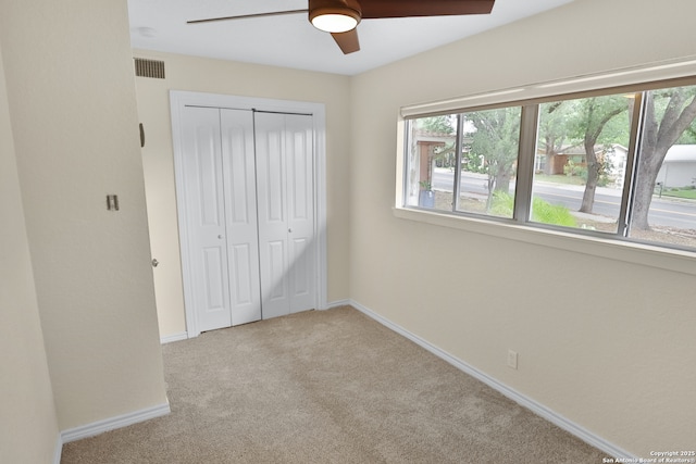 230 Tammy Dr, San Antonio, TX 78216 - unfurnished bedroom featuring a closet, carpet floors, baseboards, and ceiling fan