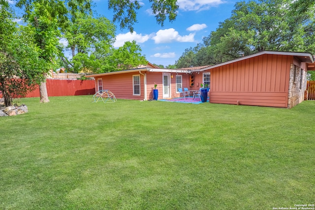 230 Tammy Dr, San Antonio, TX 78216 - back of property with board and batten siding and a patio
