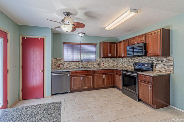 7202 Archers Coach, San Antonio, TX 78244 - kitchen with appliances with stainless steel finishes, decorative backsplash, ceiling fan, stone counters, and light tile patterned floors