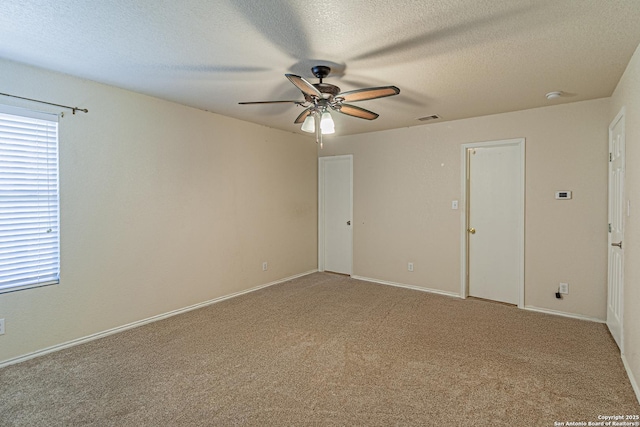7202 Archers Coach, San Antonio, TX 78244 - empty room featuring ceiling fan, light carpet, a textured ceiling, and baseboards