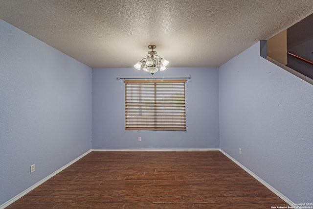 7202 Archers Coach, San Antonio, TX 78244 - spare room featuring a chandelier, wood finished floors, baseboards, and a textured ceiling