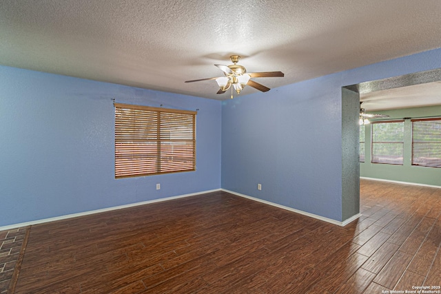 7202 Archers Coach, San Antonio, TX 78244 - spare room with ceiling fan, wood finished floors, a textured ceiling, and baseboards