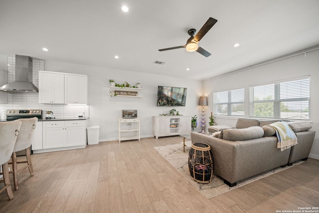 1226 Wyoming Unit 201, San Antonio, TX 78203 - living room featuring ceiling fan, recessed lighting, light wood-style floors, and baseboards