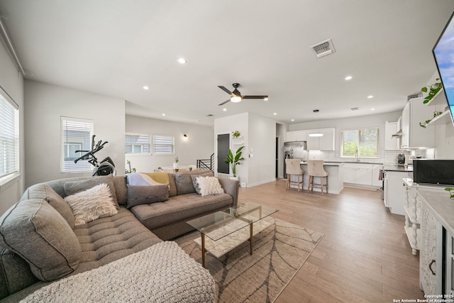 1226 Wyoming Unit 201, San Antonio, TX 78203 - living area featuring light wood finished floors, a ceiling fan, recessed lighting, and baseboards
