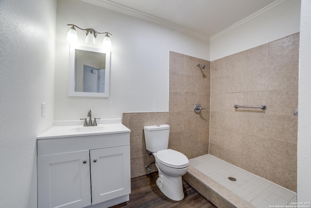 4335 Misty Spgs, San Antonio, TX 78244 - full bathroom with a tile shower, crown molding, toilet, vanity, and wood finished floors
