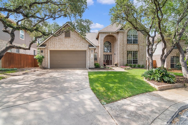 2610 Plum Holw, San Antonio, TX 78258 - traditional home featuring brick siding, an attached garage, concrete driveway, and roof with shingles