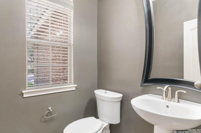 2610 Plum Holw, San Antonio, TX 78258 - half bath with a sink and toilet