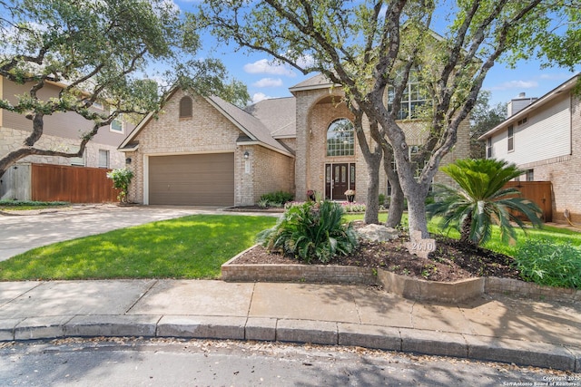 2610 Plum Holw, San Antonio, TX 78258 - traditional-style house with brick siding, concrete driveway, and an attached garage