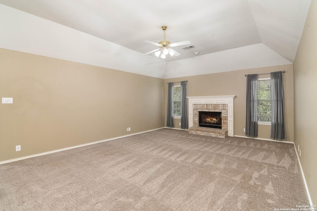 2610 Plum Holw, San Antonio, TX 78258 - unfurnished living room with carpet floors, a brick fireplace, baseboards, and vaulted ceiling
