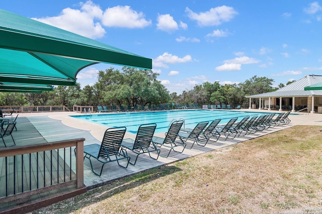 2610 Plum Holw, San Antonio, TX 78258 - community pool featuring a patio area and view of wooded area