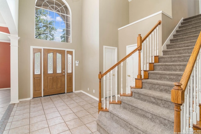 2610 Plum Holw, San Antonio, TX 78258 - tiled foyer entrance with a high ceiling, stairway, baseboards, and ornate columns