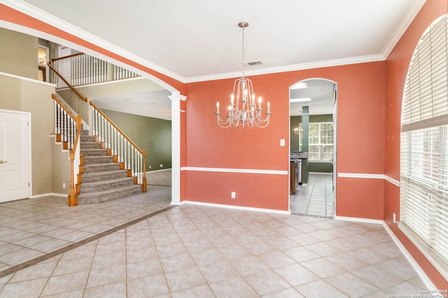 2610 Plum Holw, San Antonio, TX 78258 - unfurnished dining area featuring light tile patterned flooring, arched walkways, baseboards, decorative columns, and crown molding