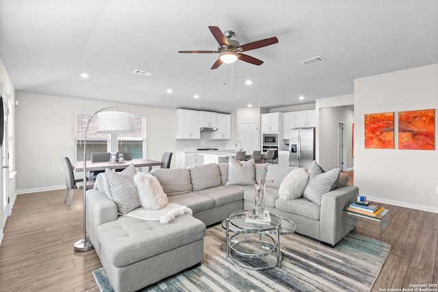 10247 Juniper Oaks, Boerne, TX 78006 - living room with baseboards, ceiling fan, light wood-type flooring, and recessed lighting