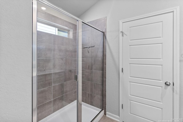 10247 Juniper Oaks, Boerne, TX 78006 - bathroom with a stall shower and a textured wall