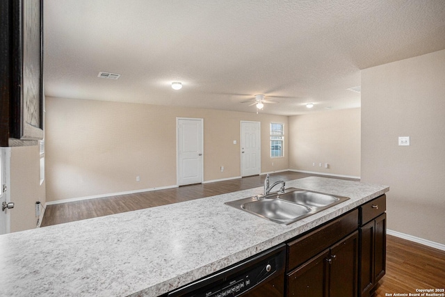 7406 Snapdragon Ct, Converse, TX 78109 - kitchen featuring a sink, black dishwasher, ceiling fan, open floor plan, and baseboards
