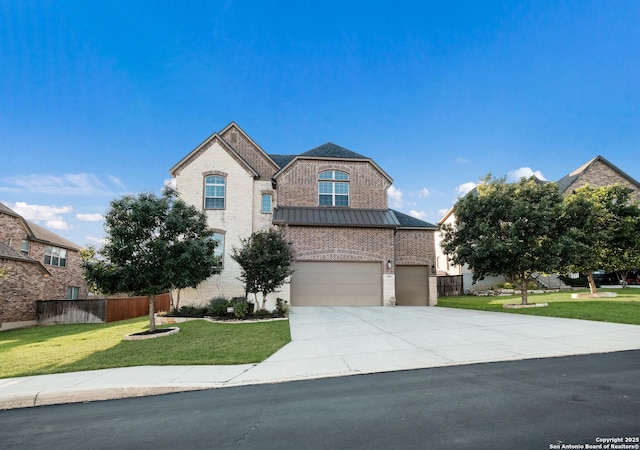 26019 Red Heron, San Antonio, TX 78261 - view of front of property with concrete driveway, a standing seam roof, brick siding, an attached garage, and metal roof