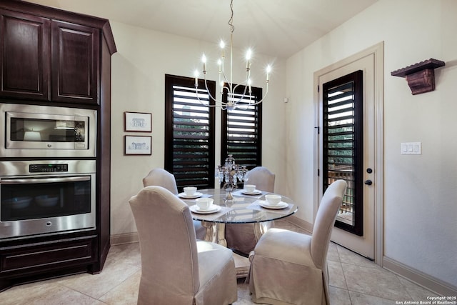 26019 Red Heron, San Antonio, TX 78261 - dining space featuring a chandelier, baseboards, and light tile patterned floors