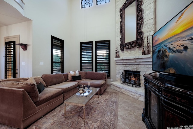 26019 Red Heron, San Antonio, TX 78261 - tiled living area featuring a fireplace and a towering ceiling