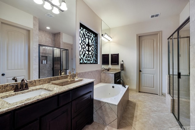26019 Red Heron, San Antonio, TX 78261 - full bath featuring a stall shower, a whirlpool tub, double vanity, and tile patterned flooring