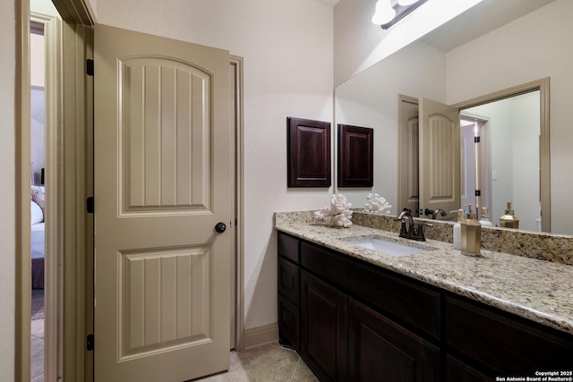 26019 Red Heron, San Antonio, TX 78261 - bathroom featuring vanity, ensuite bathroom, and tile patterned floors