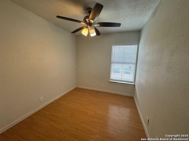 2854 Cherry Fld, San Antonio, TX 78245 - spare room with light wood-style floors, baseboards, and ceiling fan