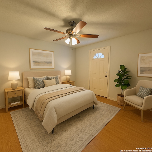 2854 Cherry Fld, San Antonio, TX 78245 - bedroom featuring light wood-style floors, baseboards, a ceiling fan, and a textured ceiling