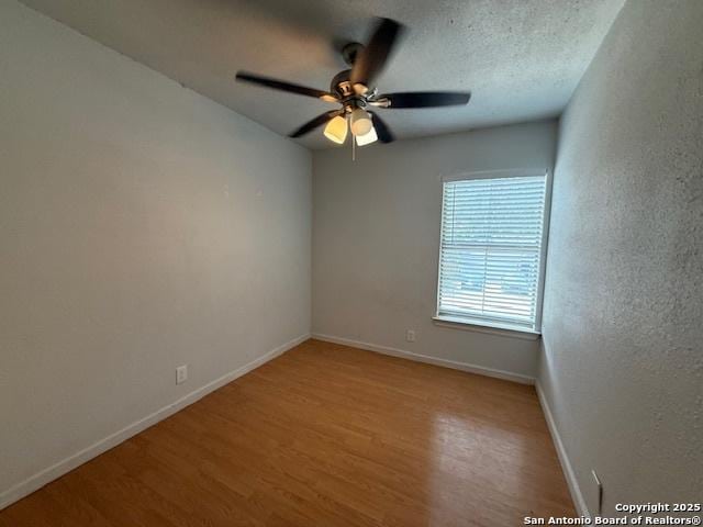 2854 Cherry Fld, San Antonio, TX 78245 - unfurnished room featuring wood finished floors, baseboards, and a ceiling fan