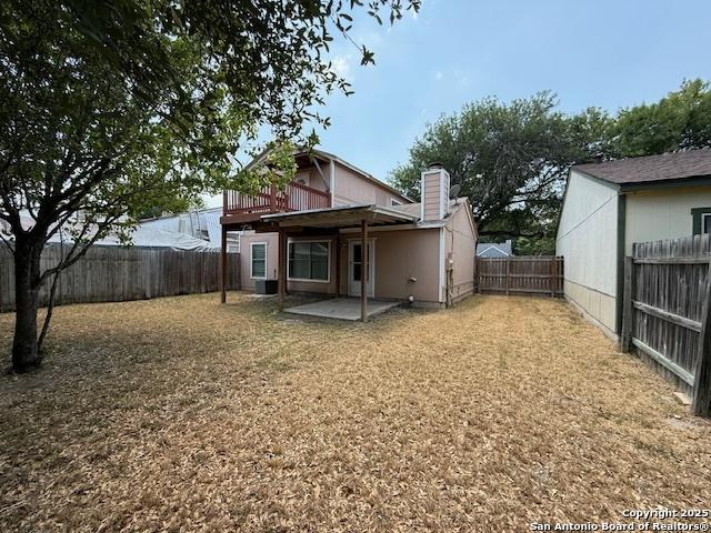 2854 Cherry Fld, San Antonio, TX 78245 - rear view of house featuring a fenced backyard and a patio