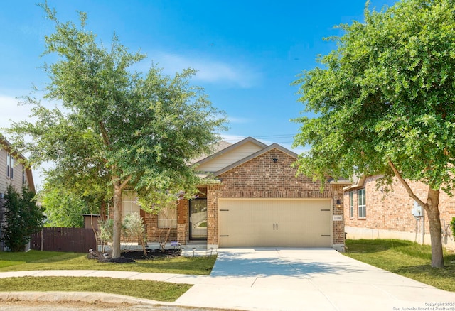 13106 Welder, San Antonio, TX 78253 - view of property hidden behind natural elements with a garage, brick siding, and driveway
