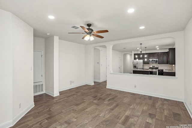 13106 Welder, San Antonio, TX 78253 - unfurnished living room featuring arched walkways, a sink, wood finished floors, recessed lighting, and ceiling fan