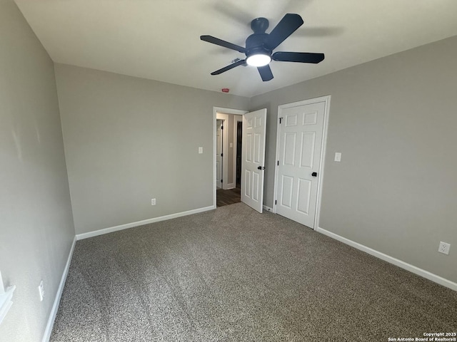 390 W Park St, Vidor, TX 77662 - unfurnished bedroom with baseboards, carpet, and ceiling fan