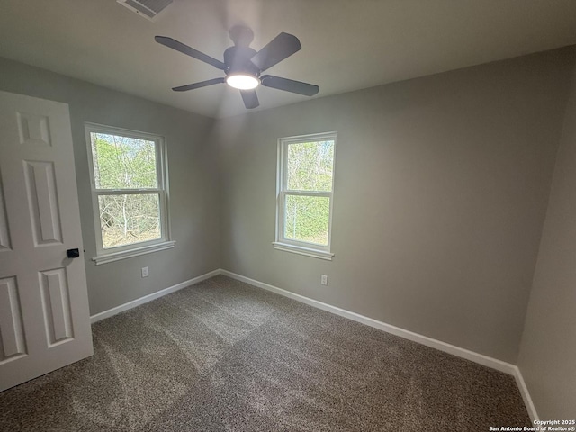 390 W Park St, Vidor, TX 77662 - carpeted empty room with plenty of natural light, baseboards, and a ceiling fan