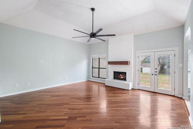 27026 Wooded Acres, San Antonio, TX 78260 - unfurnished living room featuring lofted ceiling, wood finished floors, a ceiling fan, healthy amount of natural light, and french doors