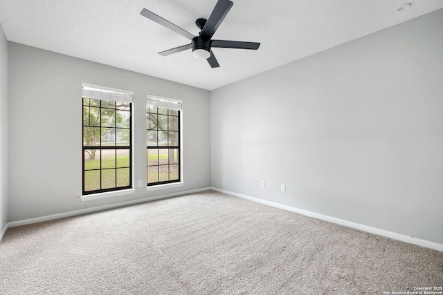 27026 Wooded Acres, San Antonio, TX 78260 - empty room with carpet flooring, baseboards, ceiling fan, and a textured ceiling