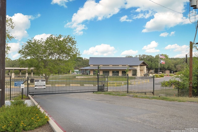 27026 Wooded Acres, San Antonio, TX 78260 - view of asphalt street with a gate and a gated entry