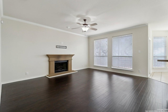 522 Mesa Rdg, San Antonio, TX 78258 - unfurnished living room featuring ceiling fan, dark wood-style floors, baseboards, crown molding, and a fireplace with raised hearth