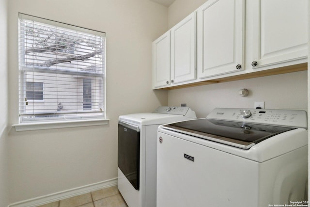 522 Mesa Rdg, San Antonio, TX 78258 - washroom featuring cabinet space, washing machine and dryer, baseboards, and light tile patterned floors
