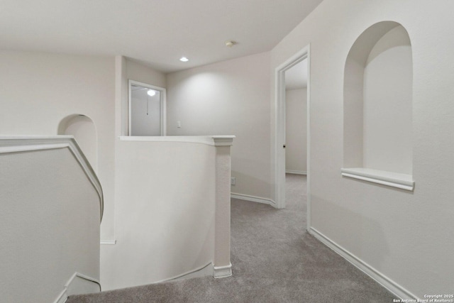 522 Mesa Rdg, San Antonio, TX 78258 - hall with carpet, an upstairs landing, and baseboards