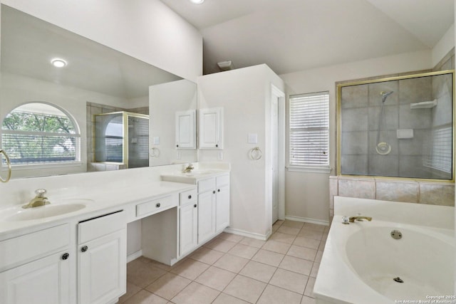 522 Mesa Rdg, San Antonio, TX 78258 - bathroom with vaulted ceiling, a stall shower, a bath, double vanity, and tile patterned flooring