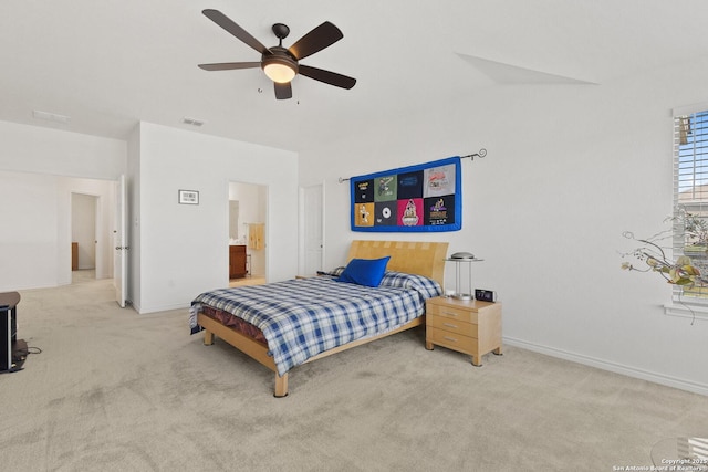 15239 Sirius Cir, San Antonio, TX 78245 - carpeted bedroom featuring baseboards, a ceiling fan, and ensuite bathroom